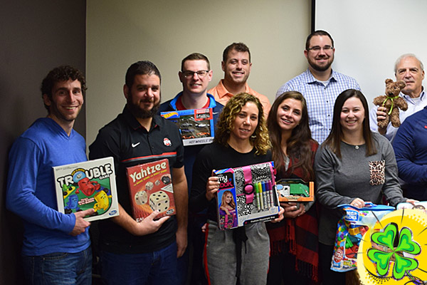 Direct Recruiters, Inc. & Direct Consulting Associates staff with toy donations